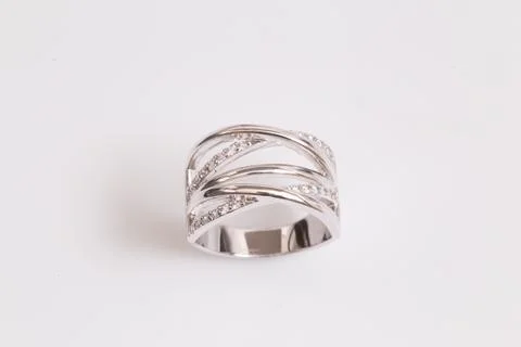 Close up of elegant diamond ring on the white background. Diamond ring. Stock Photos