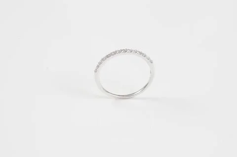 Close up of elegant diamond ring on the white background. Diamond ring. Stock Photos