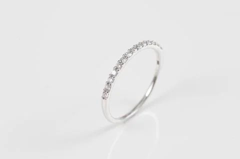 Close up of elegant diamond ring on the white background. Diamond ring. Stock Photos