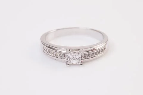 Close up of elegant diamond ring on the white background. Diamond ring. Stock Photos