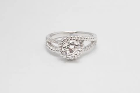 Close up of elegant diamond ring on the white background. Diamond ring. Stock Photos