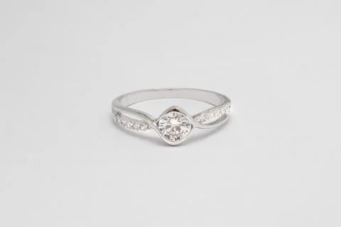 Close up of elegant diamond ring on the white background. Diamond ring. Stock Photos