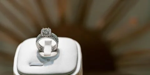 Close up of elegant diamond ring on a white box with blurry background. soft Stock Photos