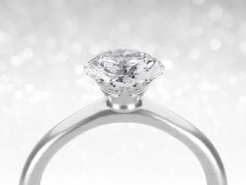 Close up of elegant diamond ring on white shining bokeh background. concept f Stock Photos