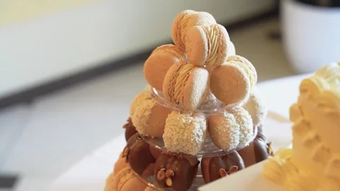Close-up of Elegant Macaron and Pastry Tower on Dessert Table in Soft Lighting 库存影片 343850096