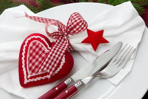 Close up of elegant red table setting - knife and fork for christmas Stock Photos