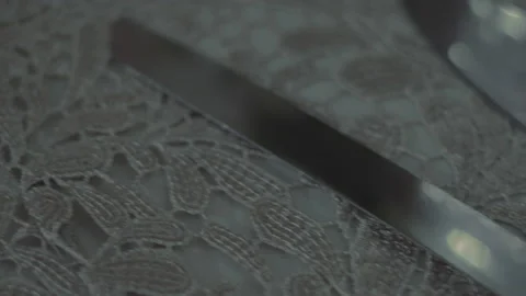 Close-up of elegant silverware on lace tablecloth 스톡 동영상 234241105