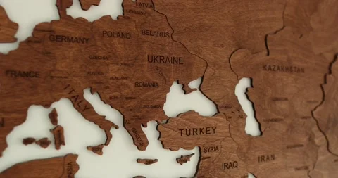 Close up of Elegant Wooden World Map in simplistic Modern Room with White Wall Stock Footage 230491445