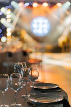 Close-up of elegantly set table with bokeh lights in background Stock Photos