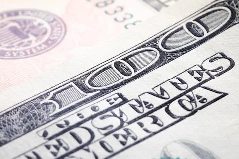 Close-up elements of a hundred dollar bill. Finance background and dollar Stock Photos