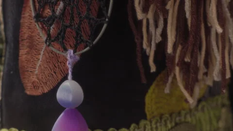 Close-up, elements of outfit and amulet on a folk rag doll serving as the Stock Footage 348253234