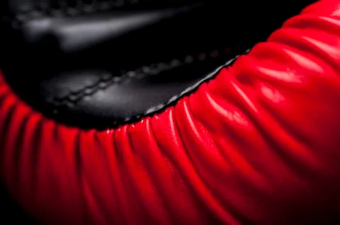 Close-up elements of red boxing leather gloves Fotos Stock