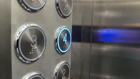 Close Up of Elevator Button Panel and finger press number 4 Stock Footage 343331023
