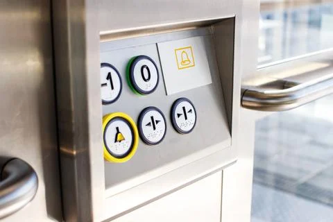 Close Up of Elevator Control Panel with Braille Buttons and Emergency Bell Stock Photos
