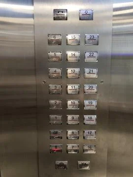 Close-up of Elevator Control Panel with Floor Buttons in High-Rise Building Foto stock