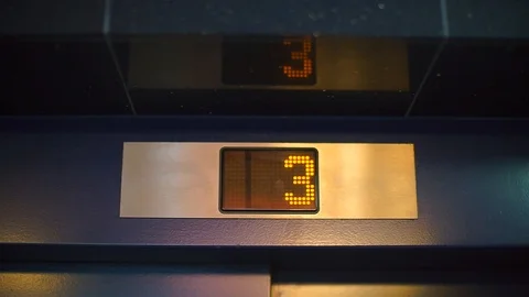 Close-up of the elevator dial on the wall in a hotel. Stock Footage 121211124