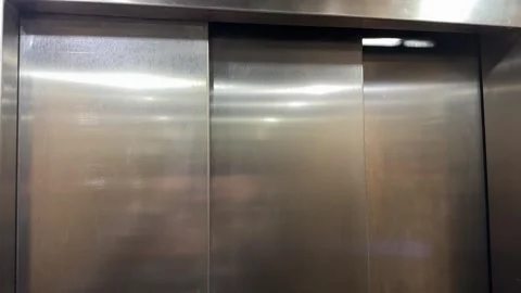 Close up of elevator doors closing as the lift begins to move Stock Footage 327183973