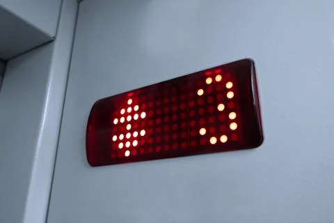 Close-up Elevator Pressing. Modern Metal Elevator. 3 floor. Vertical photo. Stock Photos