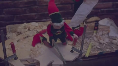 Close up of elf working in a Christmas workshop in Schilliger in Gland Stock Footage 293457793