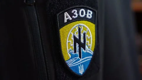 Close-up of an embroidered military patch with the word AZOV displayed on dark Stock Footage 304590915
