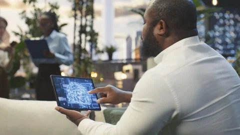 Close up of employee using tablet touchscreen to interact with AI assistant Stock Photos