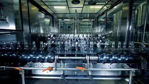 Close up of empty blue plastic bottles. Row of bottle in conveyer at water Video stock 334588108