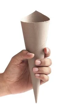 Close-up of empty brown Paper cone bag holding in hand, for  snack packaging, 스톡 사진