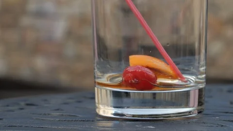 Close up empty coctail glass cherry and straw Stock Footage 102771939