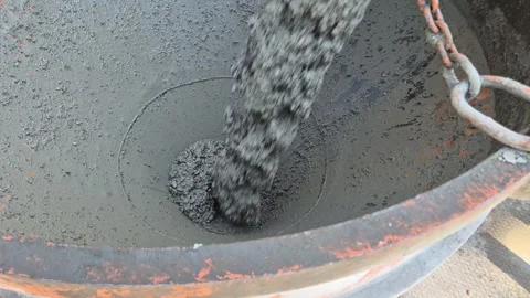 Close-up of empty concrete bucket being filled with cement – Slow Motion 스톡 동영상 344030981
