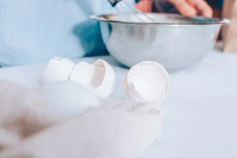 Close-up empty egg shells on white table 스톡 사진