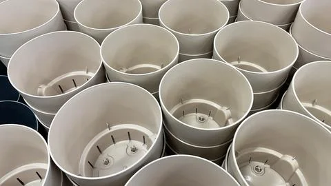Close-up of empty flower pots in a store or greenhouse. Colorful pots for plants Stock Photos