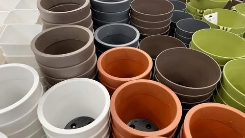 Close-up of empty flower pots in a store or greenhouse. Colorful pots for plants Stock Photos