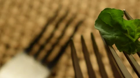Close up on empty forks with arugula Stock Footage 136361701