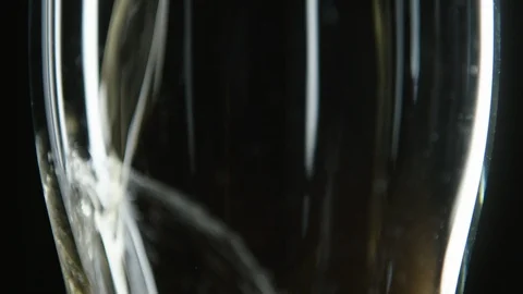 Close up of empty glass being filled with golden beer Stock Footage 93562264
