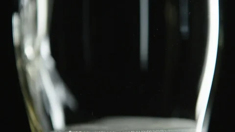 Close up of empty glass being filled with golden beer Stock Footage 93562445