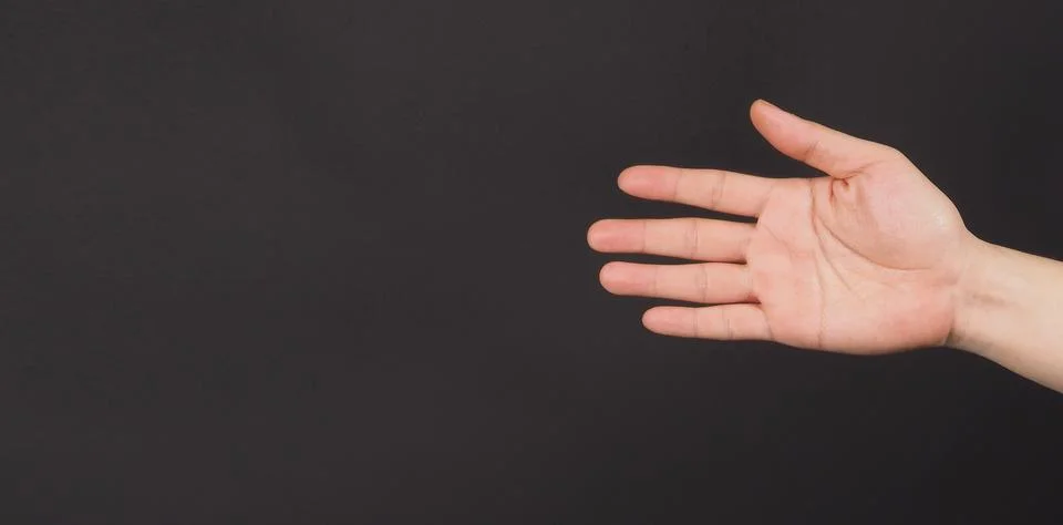 CLOSE UP OF empty hand palm splate five fingers isolated on black backgroun.. Stock Photos