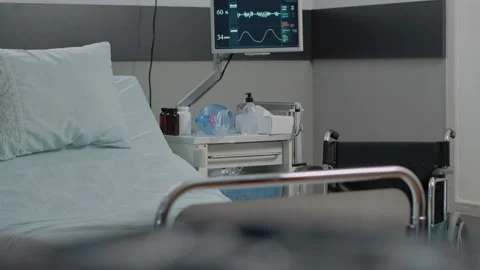 Close up of empty hospital ward bed with medical equipment Stock Footage 162896229