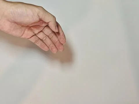 Close-up of Empty Human Hand Reaching Out on Neutral Background Stock Photos