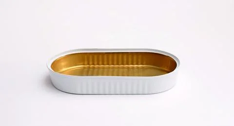 Close-up of an empty oval tin can on a white background. Stock Photos