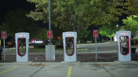 Close up of the empty recharging Tesla stations for electro mobiles at night Stock Footage 318629584