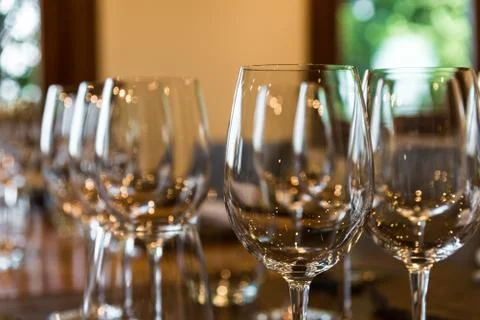 Close up of empty red wine and white wine glasses in the tasting room. Stock Photos