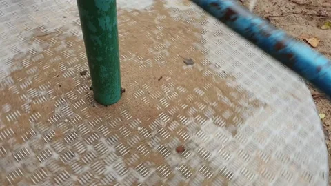 Close-up of an empty spinning carousel in a playground Stock Footage 144244828