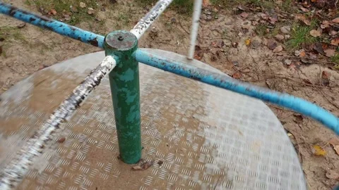 Close-up of an empty spinning carousel in a playground Stock Footage 144244842