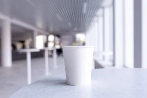 Close up of empty white cup on white interior Foto stock