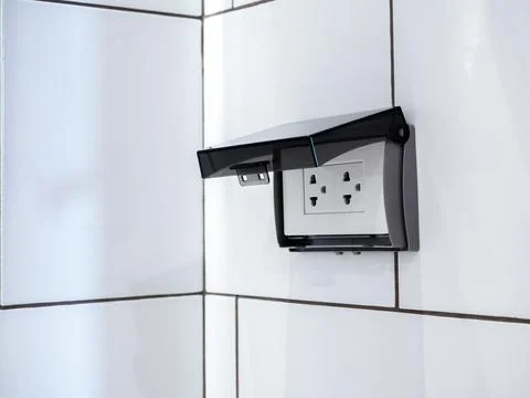 Close-up empty white electrical plug socket plate panel with transparent plas Stock Photos