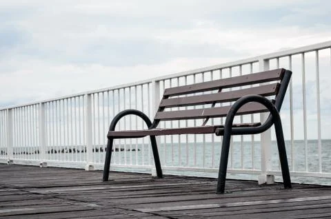 Close-up of  empty  wood sitting  bench on a  pontoon bridge      at seashore Stock Photos