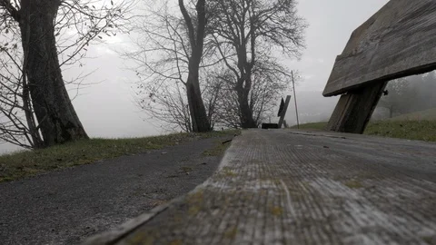 Close-up of empty wooden bench at a park in the winter. Video stock 119979699