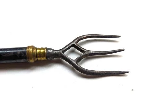 Close up of enamelled metal toasting fork Stock Photos