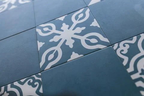 Close-up of encaustic cement tiles creating repeating geometric pattern Stock Photos
