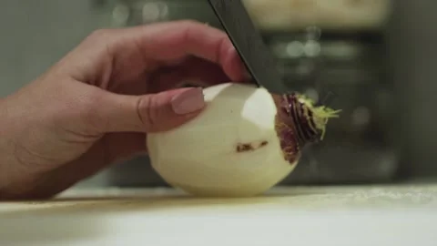 A Close up of end of turnip being cut on cutting board Stock Footage 155454199